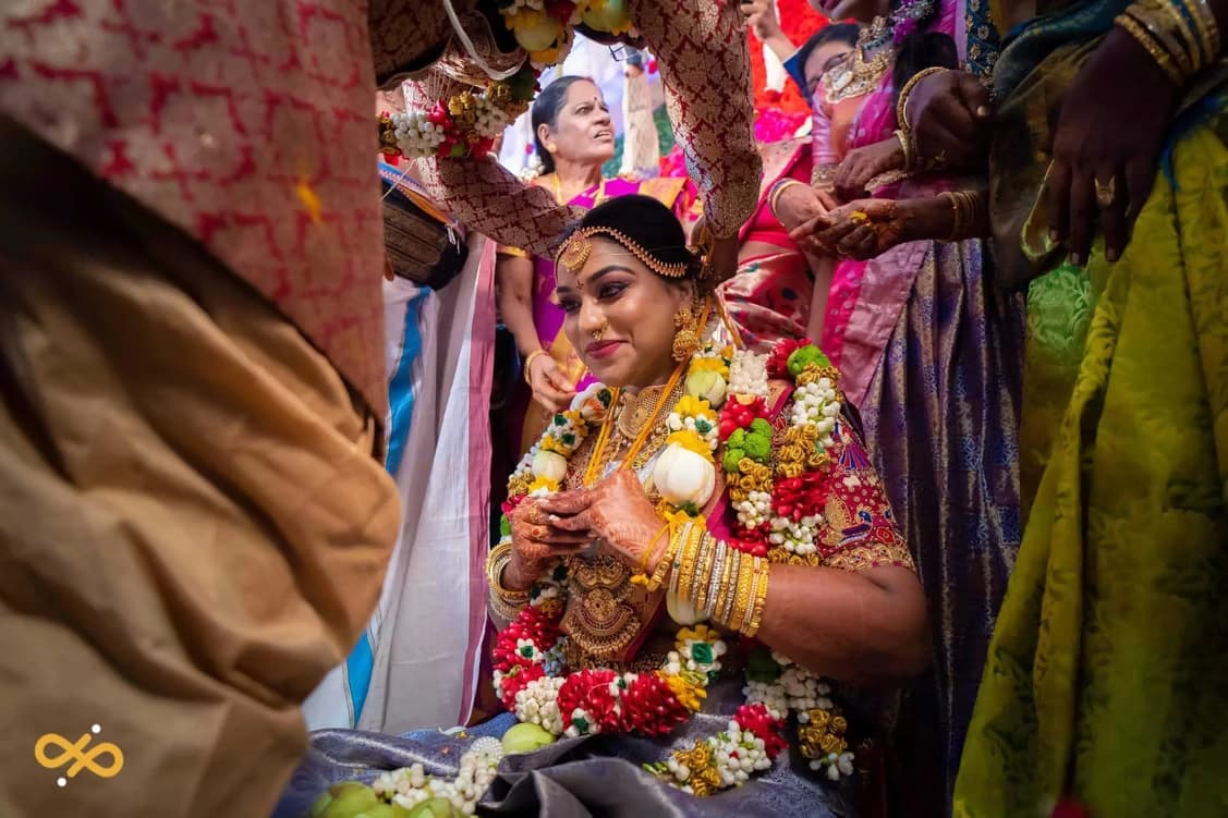Bride adorned in floral garlands